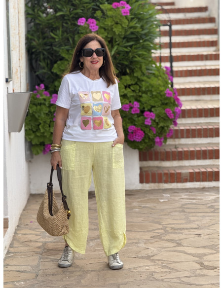 Pantalón de lino amarillo con cintura elástica y bajo asimétrico