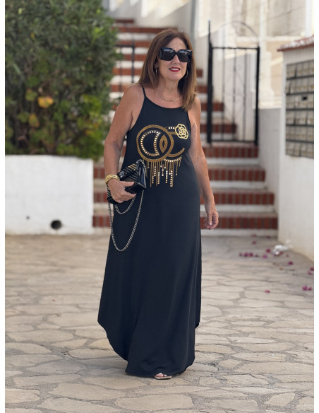 Vestido negro tirante fino con tachas doradas