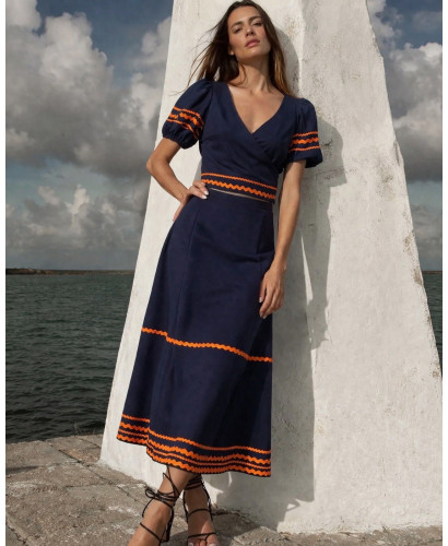 Conjunto de top y falda azul marino con piculina naranja