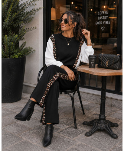 Conjunto negro técnico con detalles animal print 2