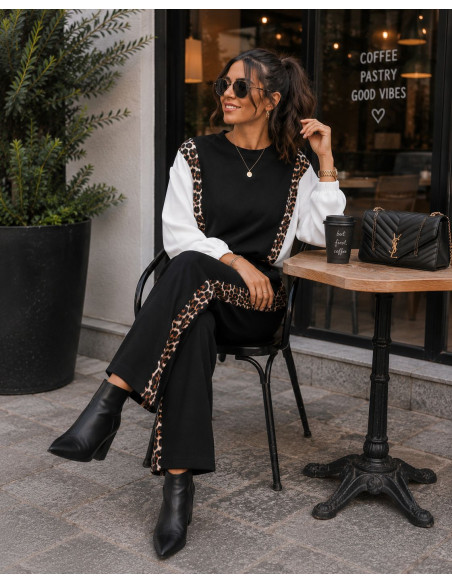 Conjunto negro técnico con detalles animal print